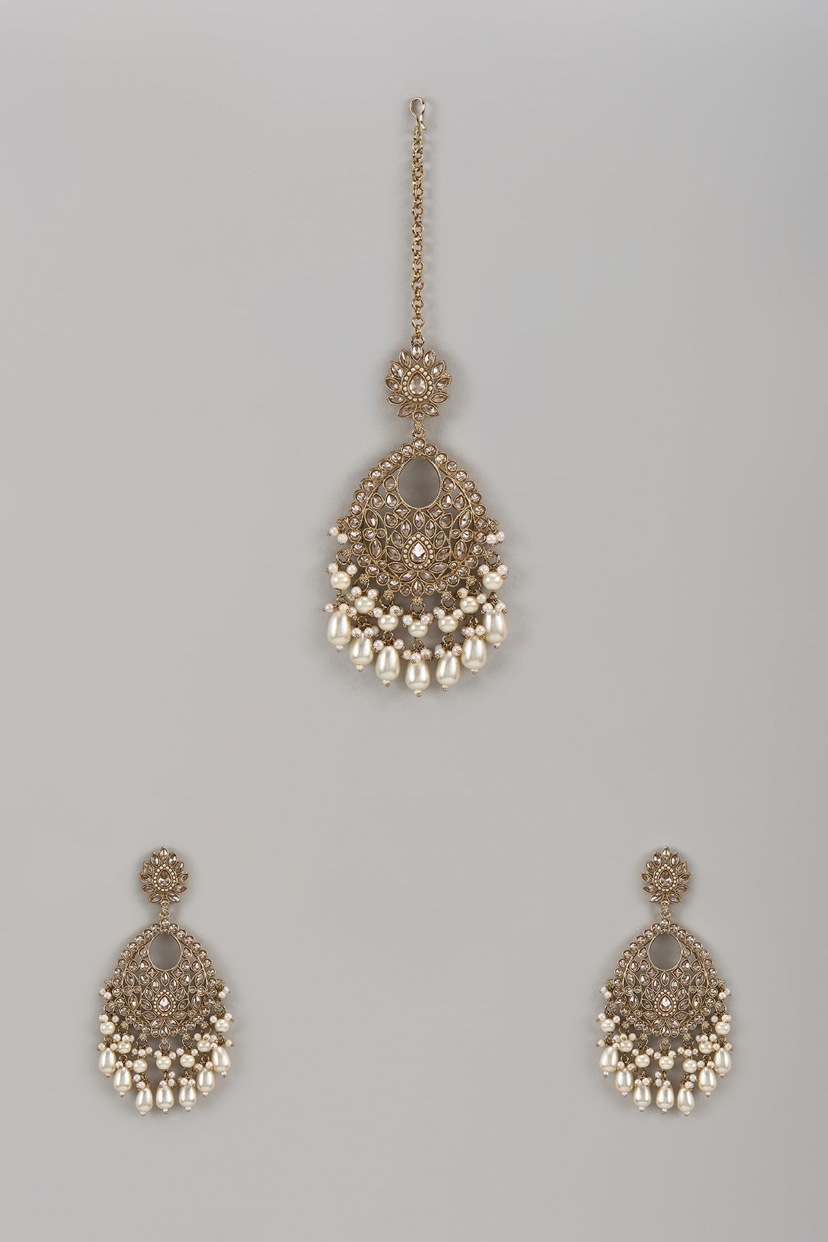Gold Finish Pearl Chandbali Earrings With Maang Tikka