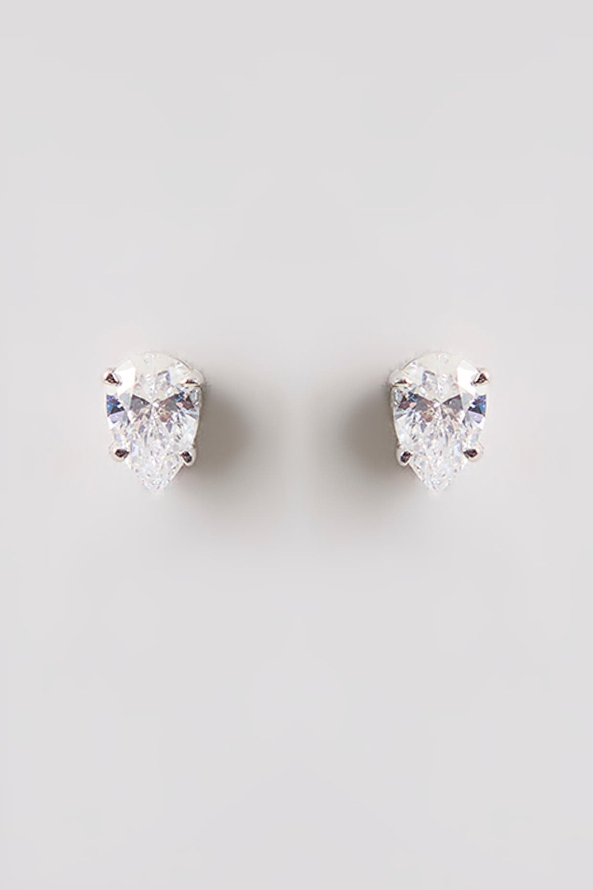White Finish White Stone Stud Earrings In Sterling Silver