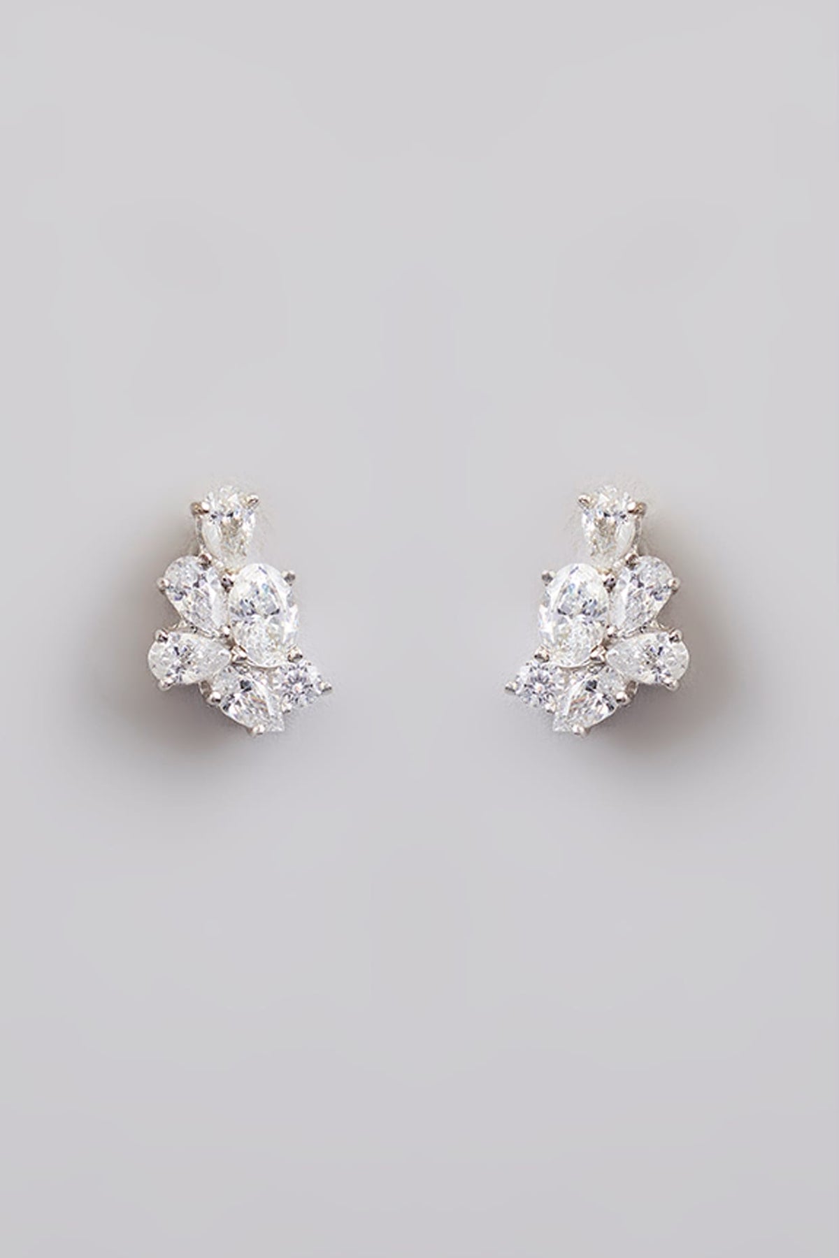 White Finish White Stone Stud Earrings In Sterling Silver