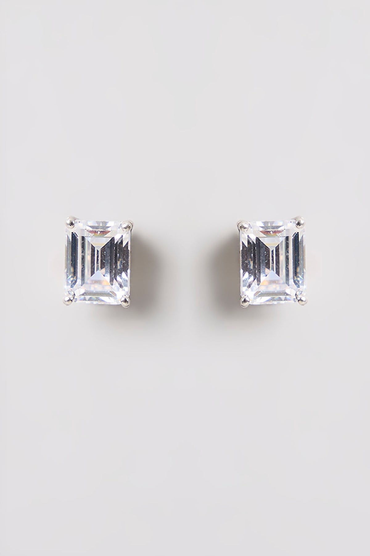 White Finish White Stone Stud Earrings In Sterling Silver