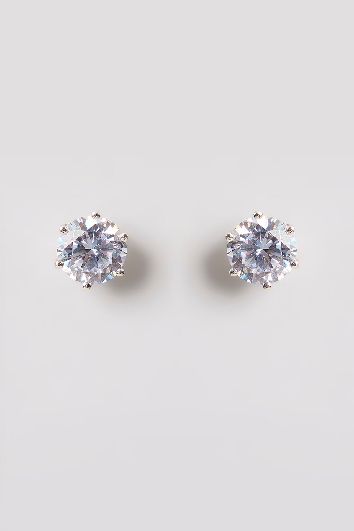 White Finish White Stone Stud Earrings In Sterling Silver