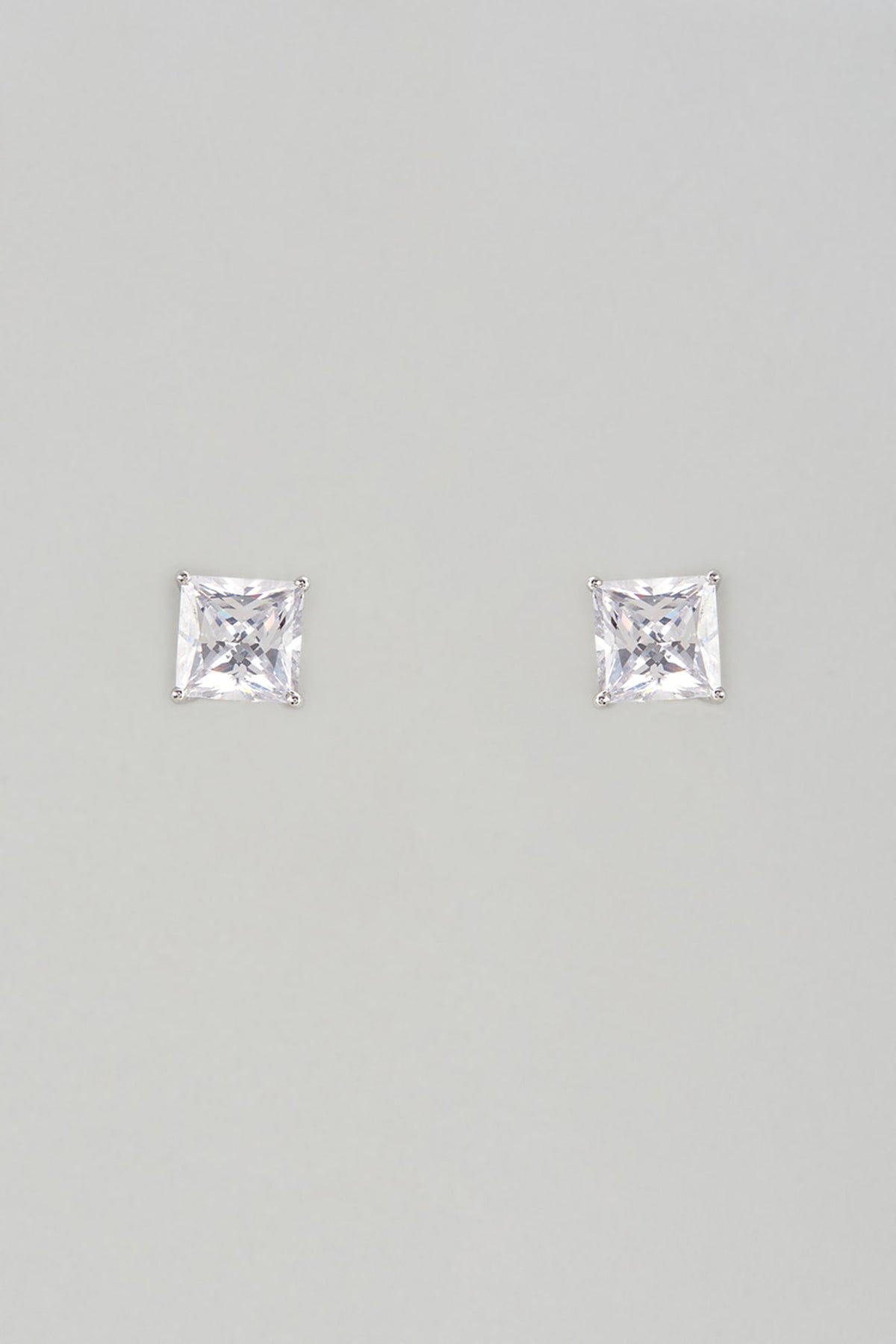 White Finish Swarovski Zircon Stud Earrings In Sterling Silver