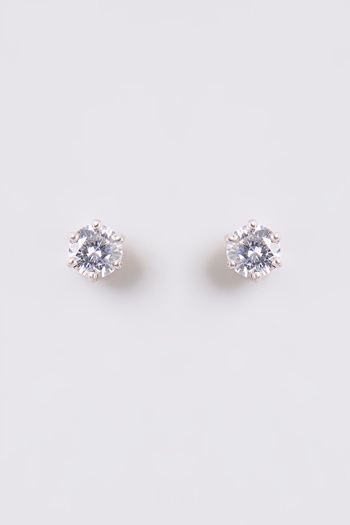 White Finish White Stone Stud Earrings In Sterling Silver