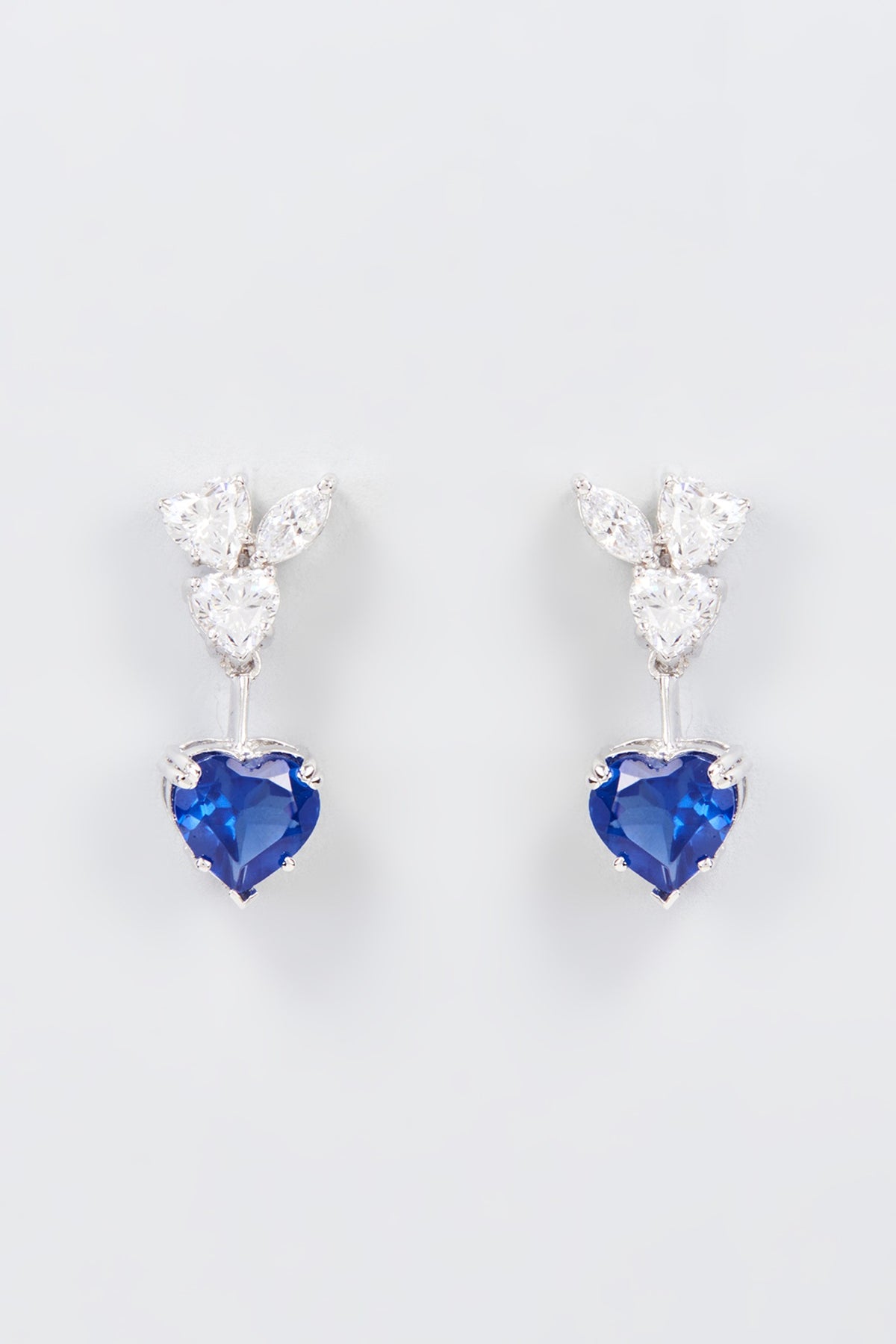 White Finish Zircon & Synthetic Blue Stone Dangler Earrings In Sterling Silver