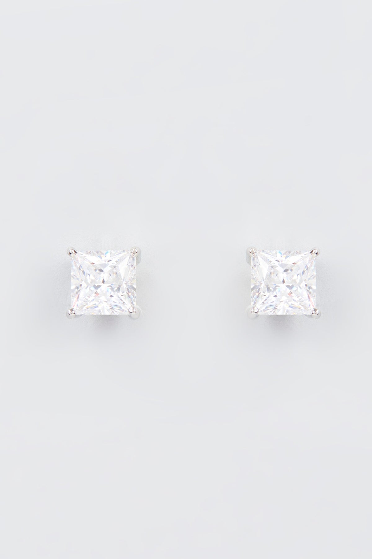 White Finish Zircon Stud Earrings In Sterling Silver