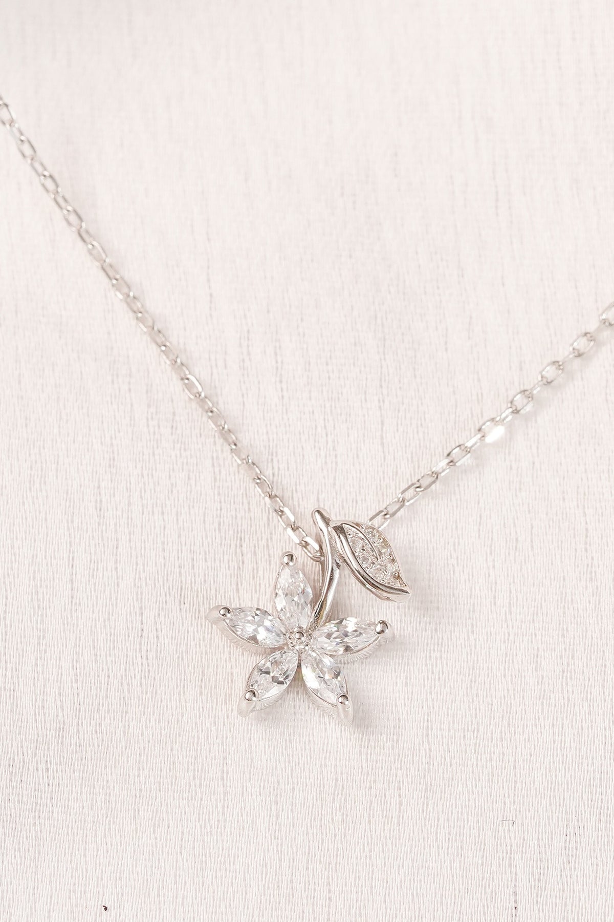 White Finish Zircon Snowflake Pendant Necklace In Sterling Silver