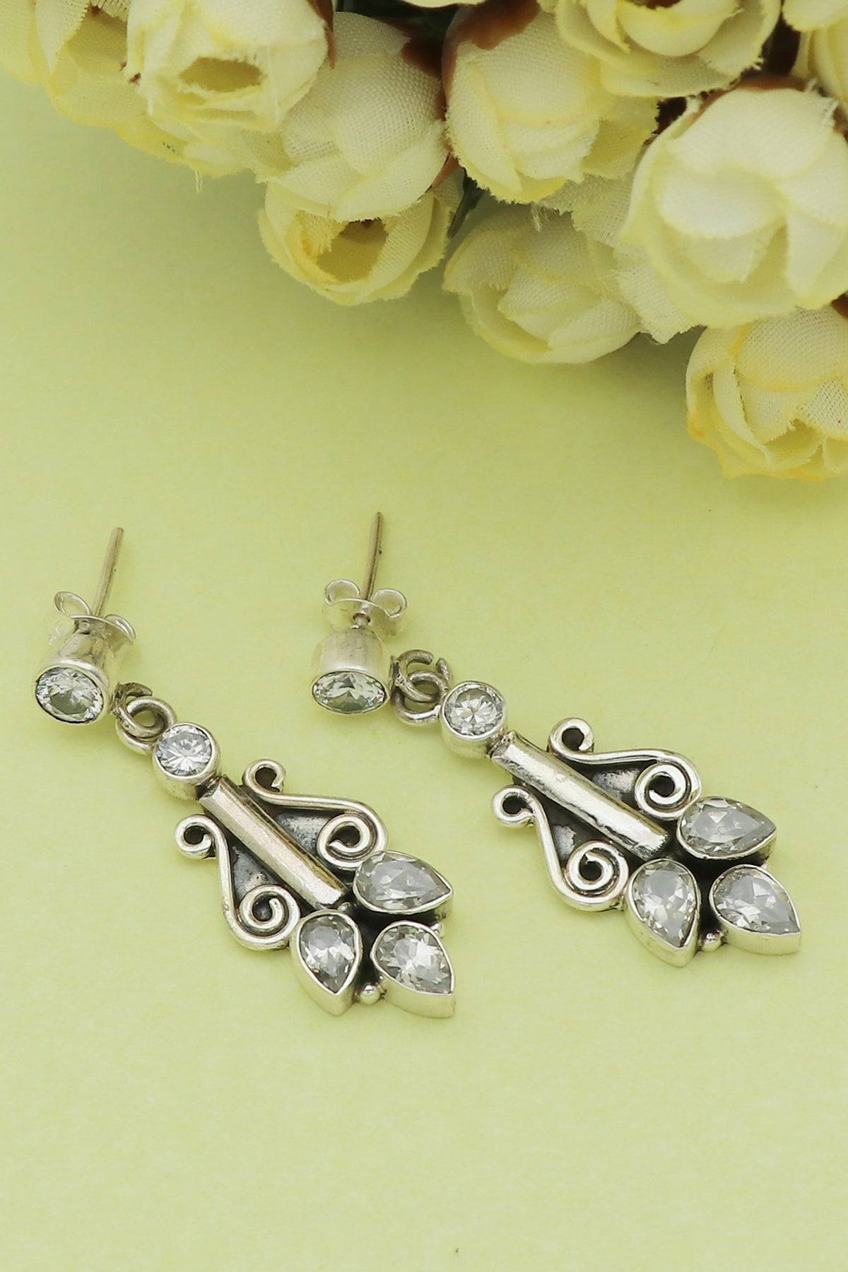 White Finish Cubic Zirconia Leaf Dangler Earrings In Sterling Silver
