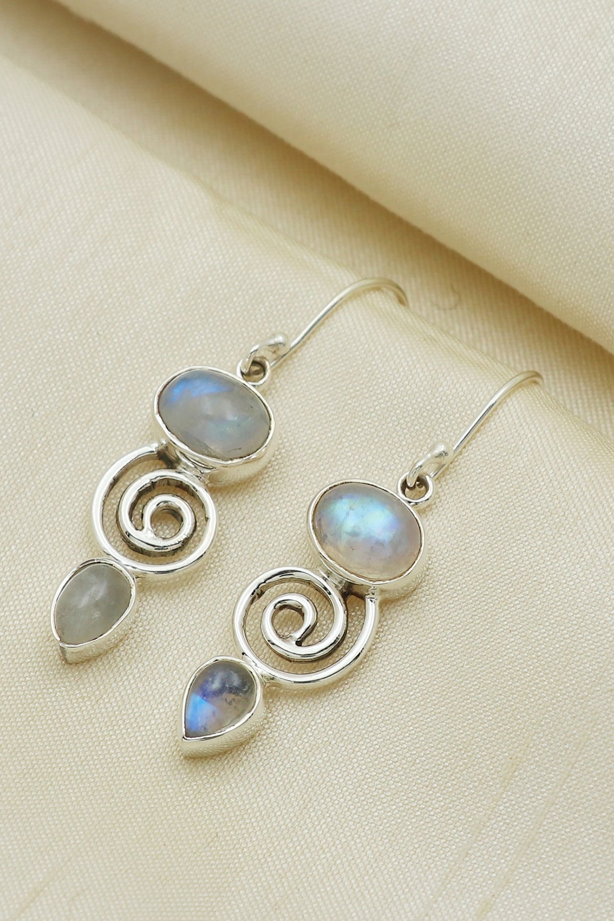 White Finish Blue Moon Stone Dangler Earrings In Sterling Silver