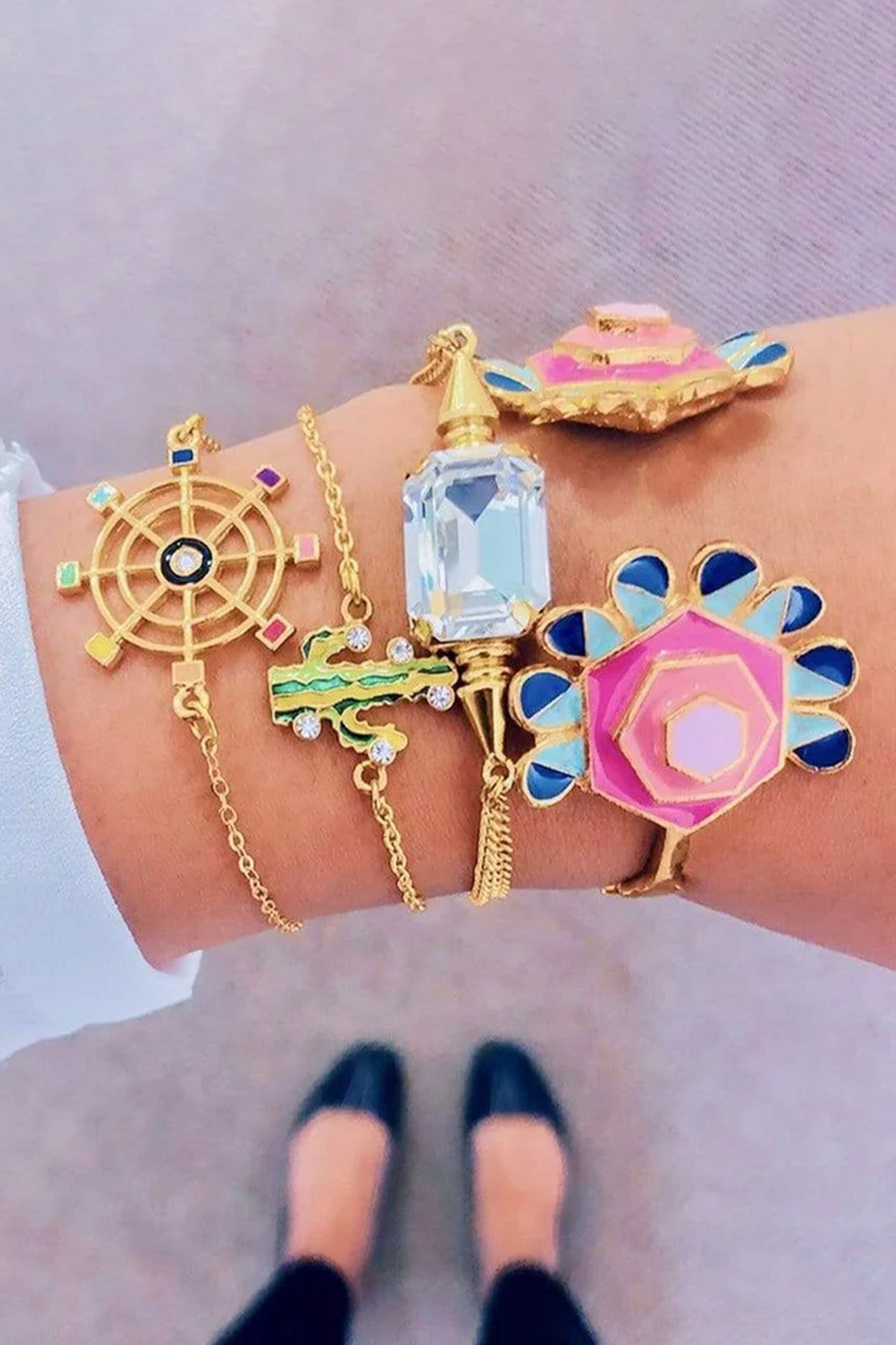Gold Toned Pinwheel Charm Bracelet 