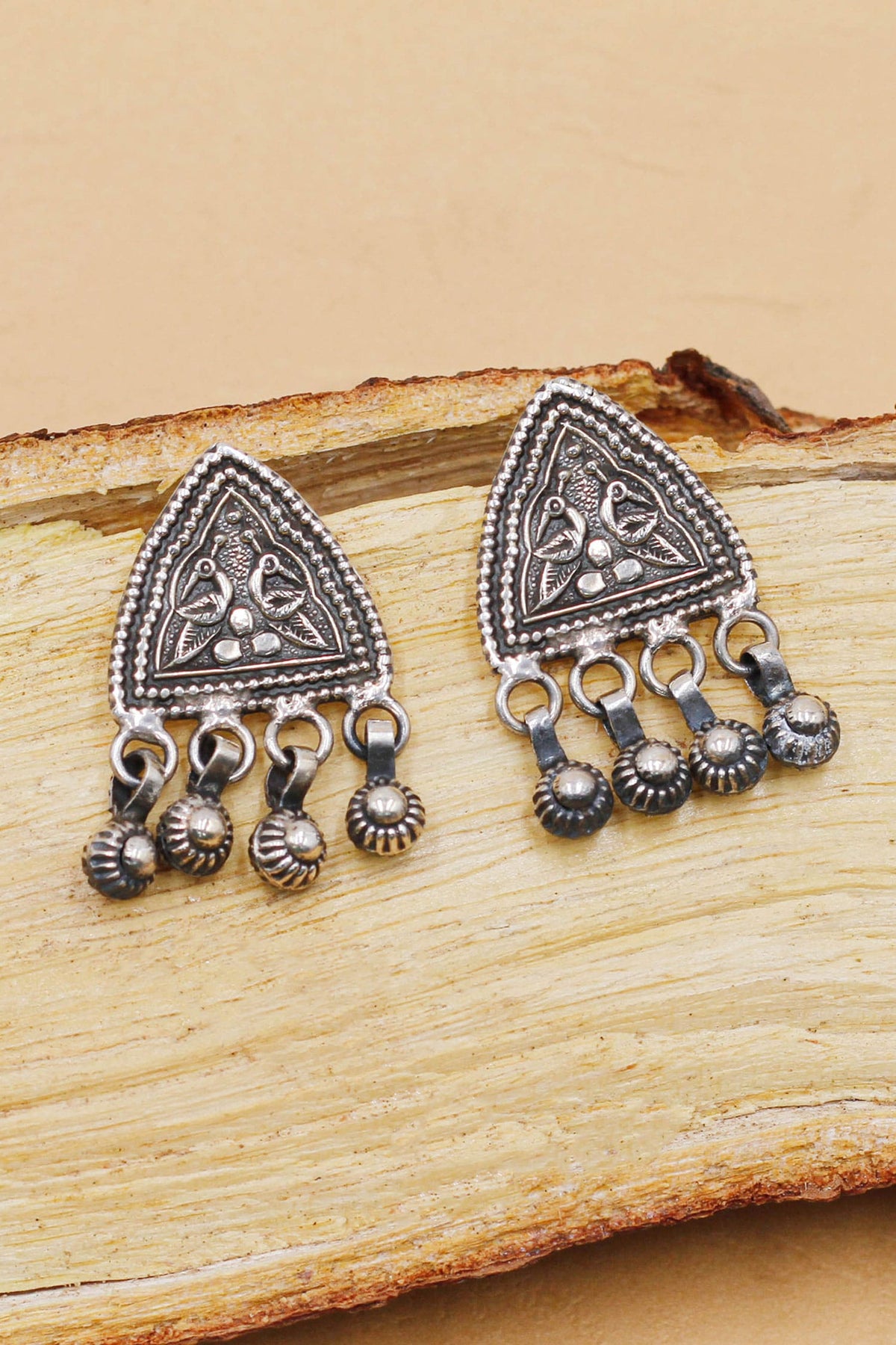 Oxidised Bird Motif Carved Earrings 