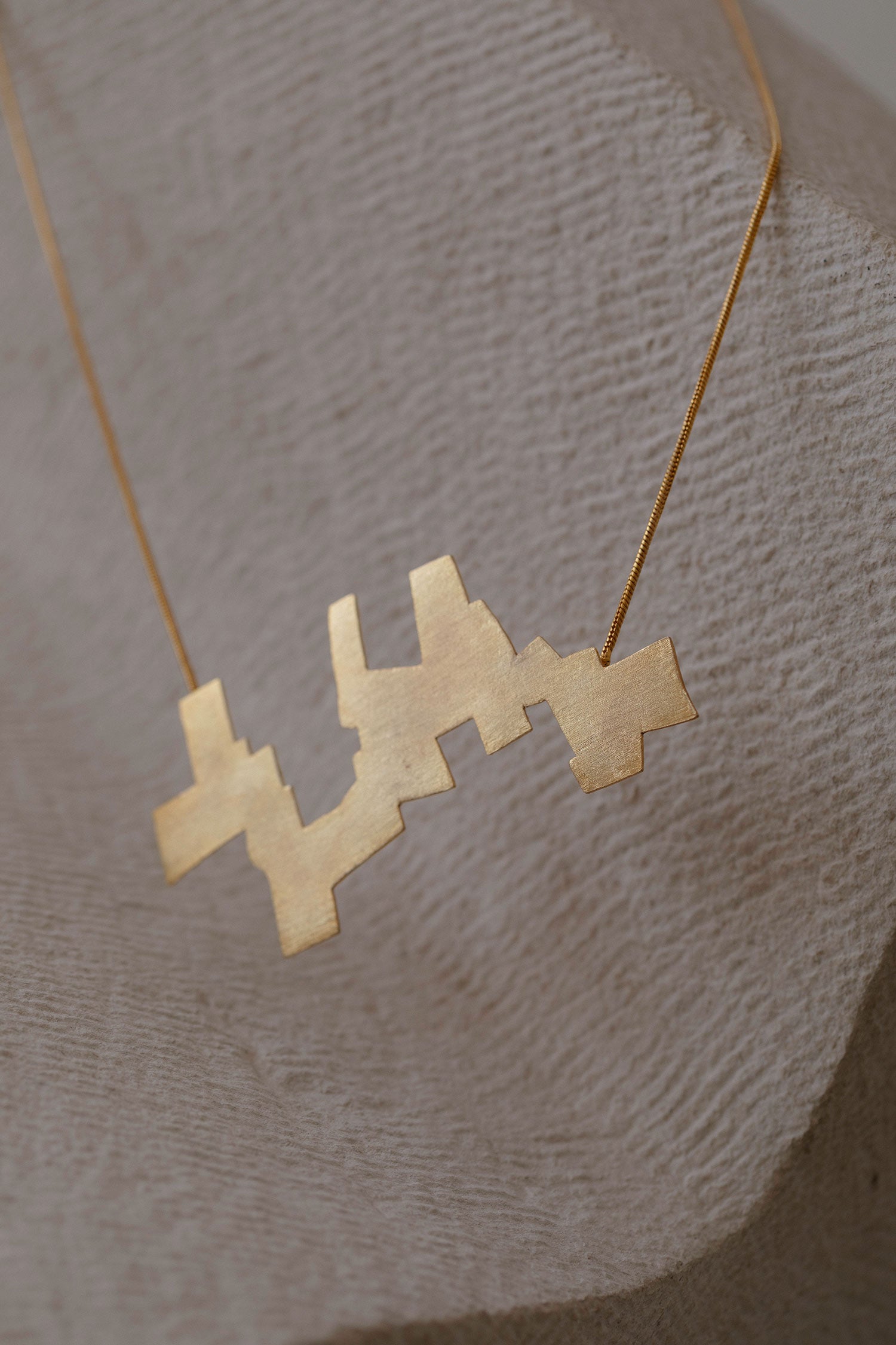 Ikur Brass Pendant Necklace 
