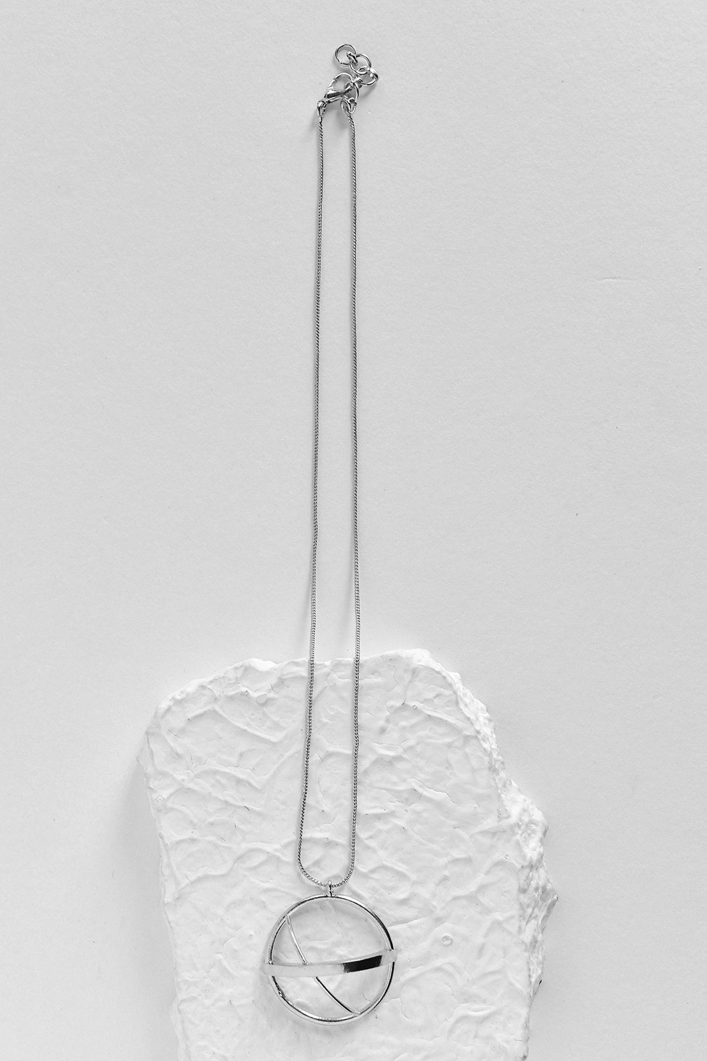 Nia Circular Carved Charm 