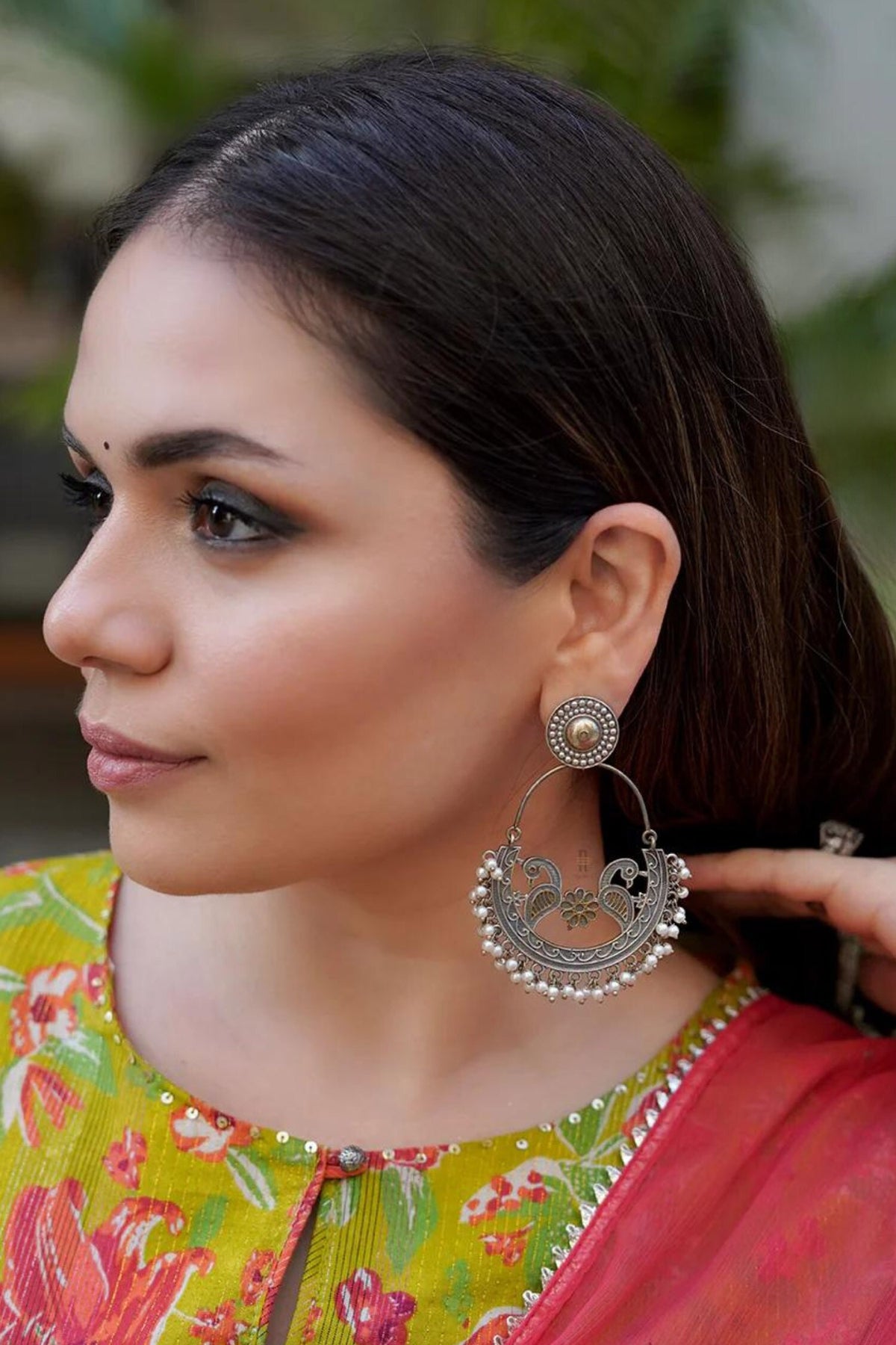 Triveni Peacock Carved Earrings 