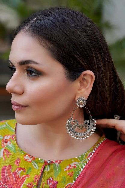 Triveni Peacock Carved Earrings 