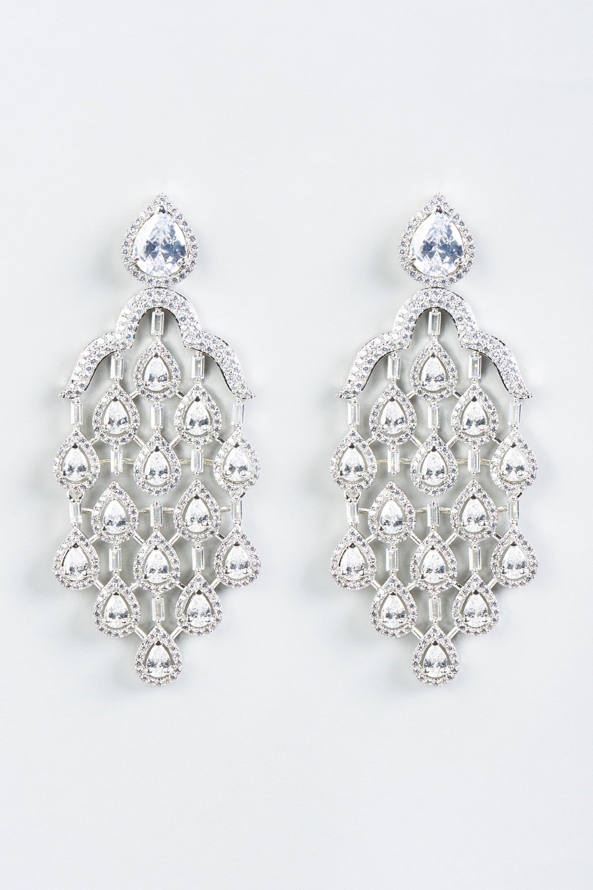 White Finish Dangler Earrings With Faux Diamonds