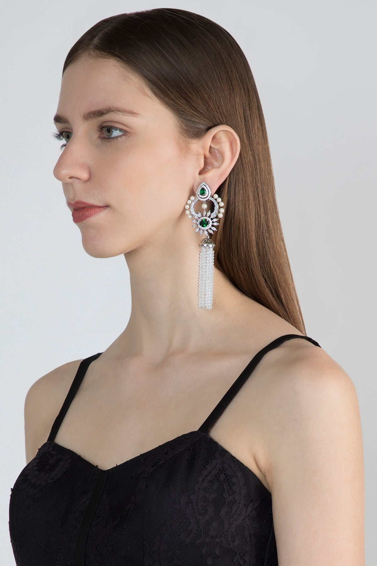 White Finish Earrings With Green Stone