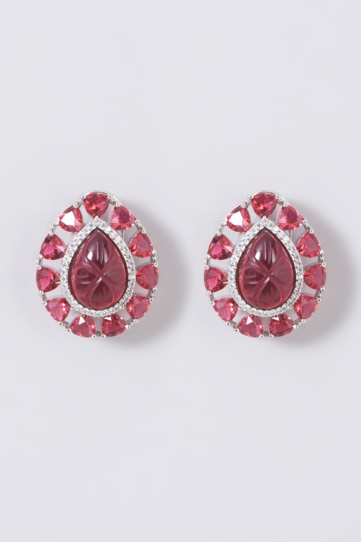 White Finish Stud Earrings With Red Stones
