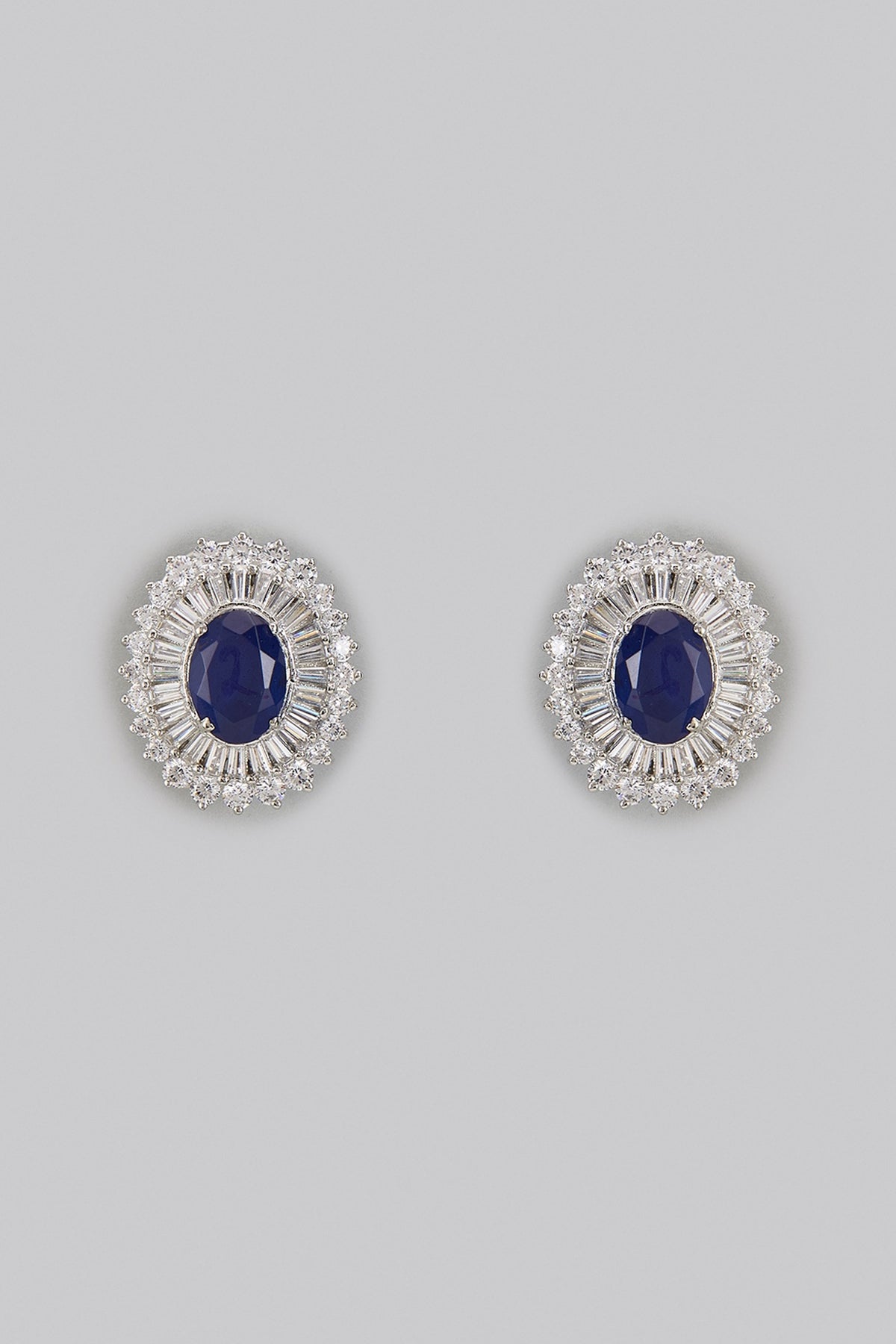 White Rhodium Finish Blue Gemstone Stud Earrings In Sterling Silver