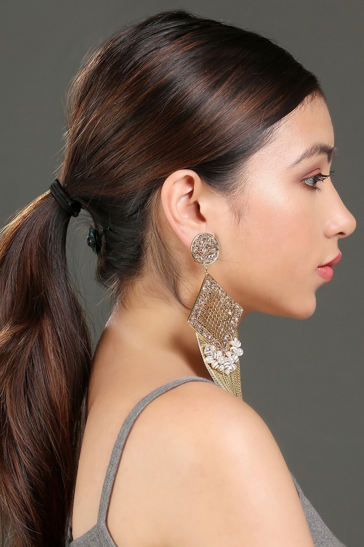 Gold Finish Tasseled Drop Earrings With Zircons