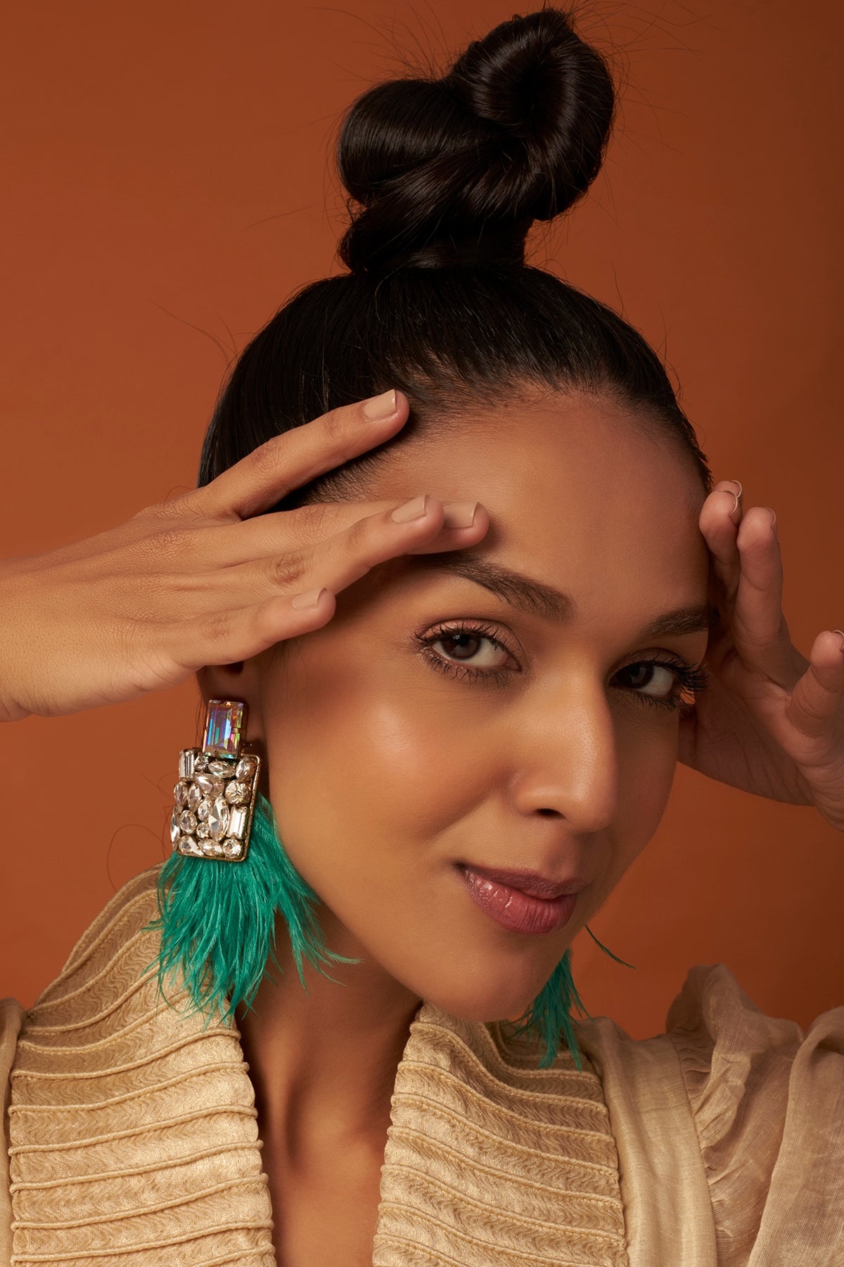 Gold Finish Dangler Earrings With Feathers