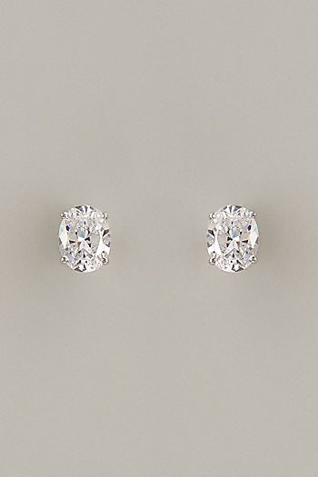 White Finish Oval Cut Swarovski Zirconia Stud Earrings In Sterling Silver