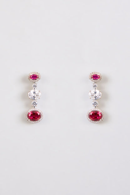White Finish Zircon & Red Stone Dangler Earrings In Sterling Silver