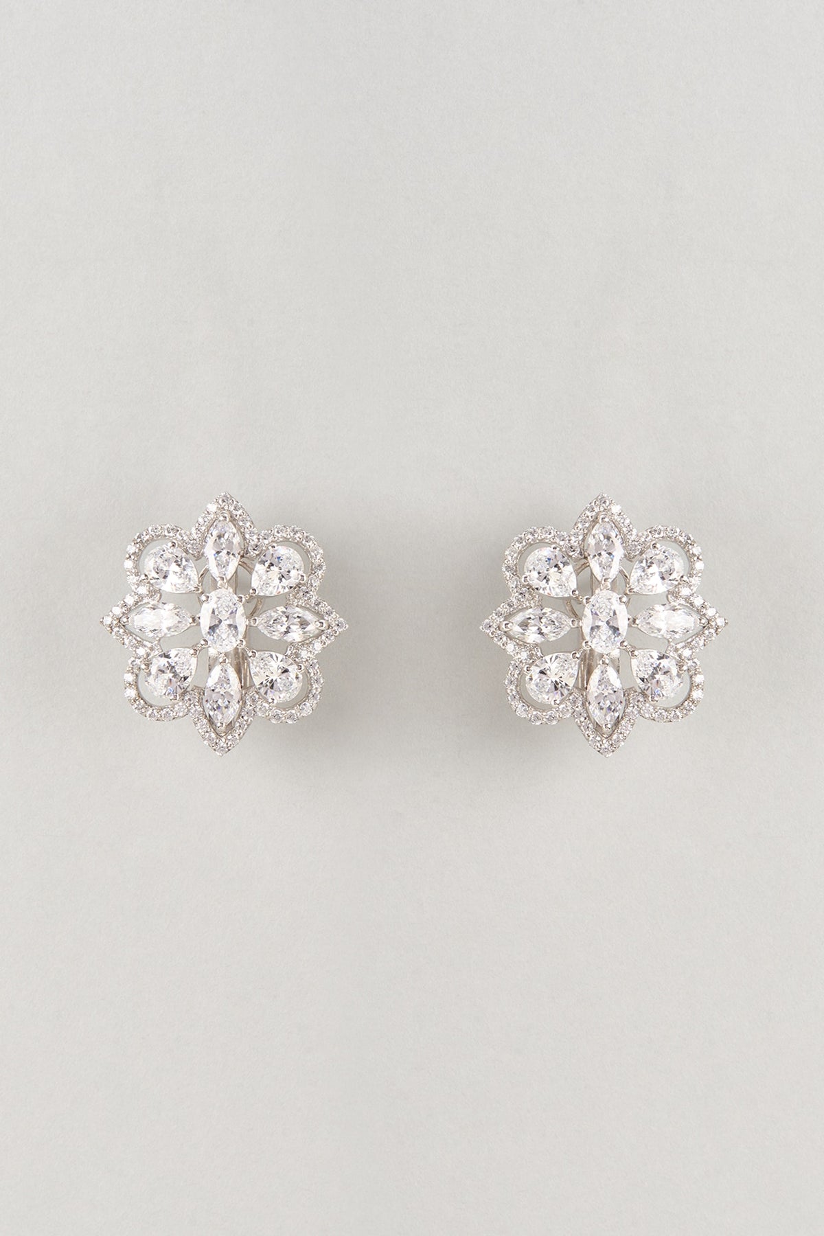 White Finish Zircon Floral Stud Earrings In Sterling Silver