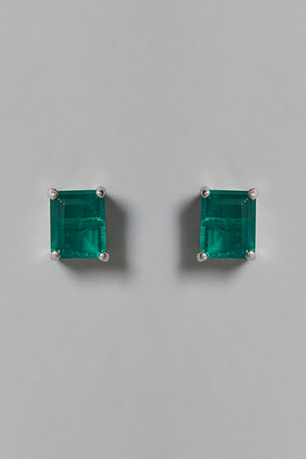 White Finish Green Swarovski Zirconia Stud Earrings In Sterling Silver