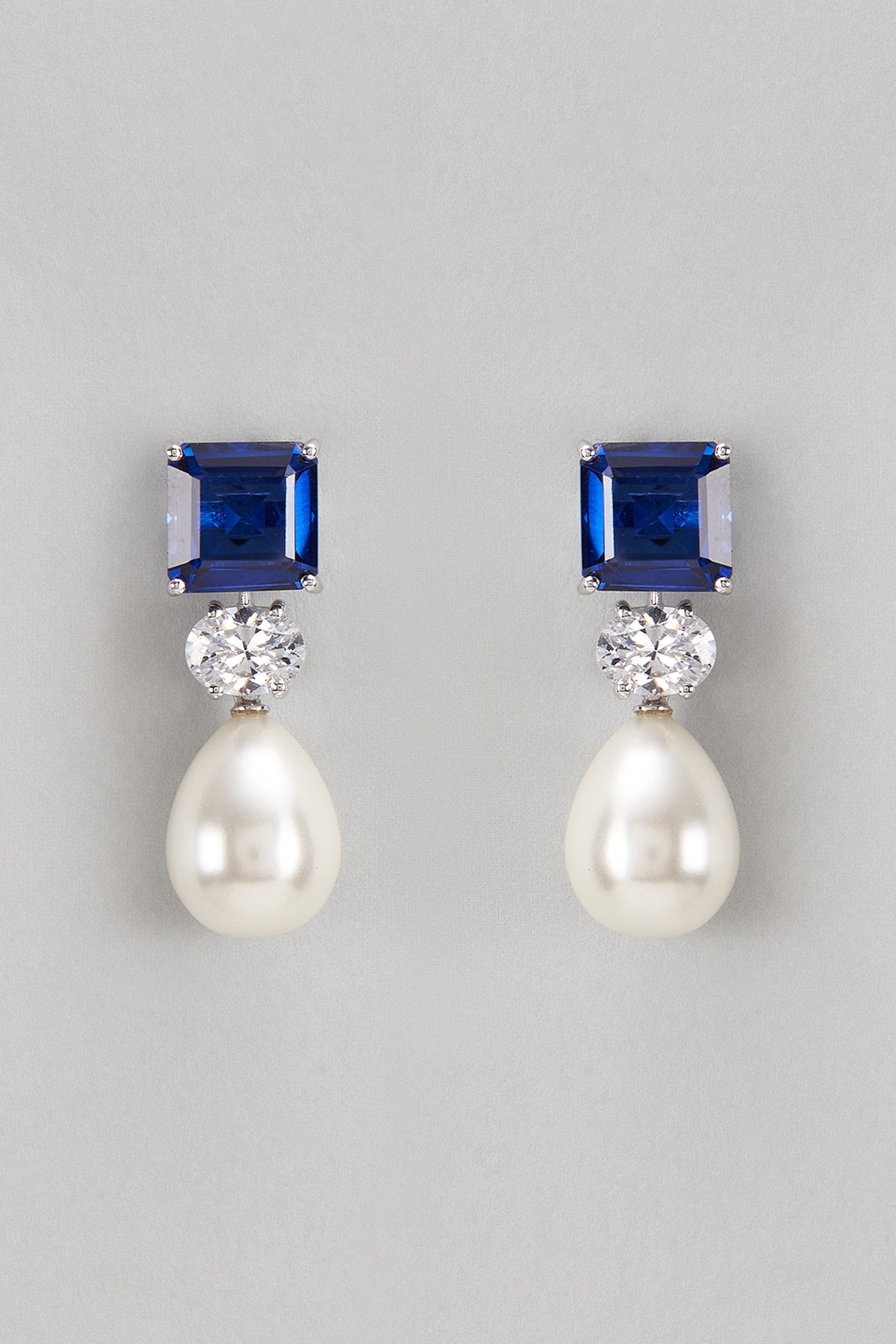 White Finish Swarovski & Synthetic Blue Stone Dangler Earrings In Sterling Silver
