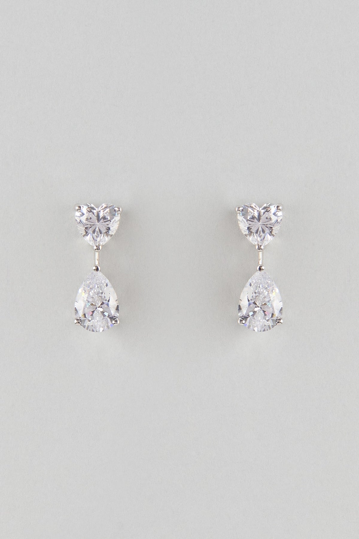 White Finish White Stone Stud Earrings In Sterling Silver