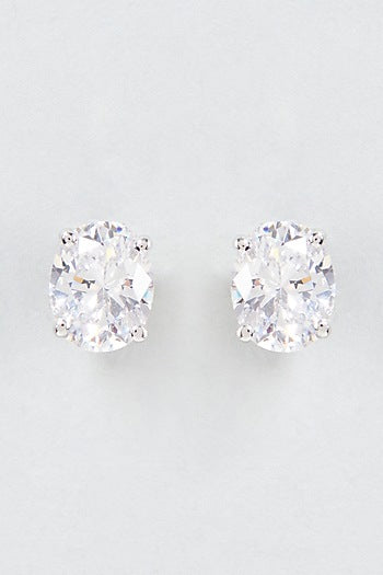 White Finish Oval Cut Swarovski Zirconia Stud Earrings In Sterling Silver