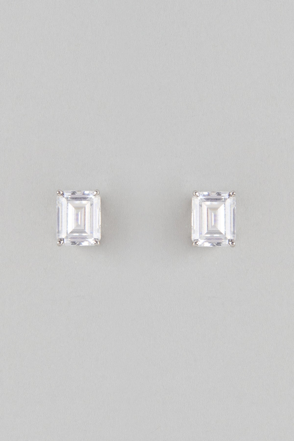 White Finish White Stone Stud Earrings In Sterling Silver