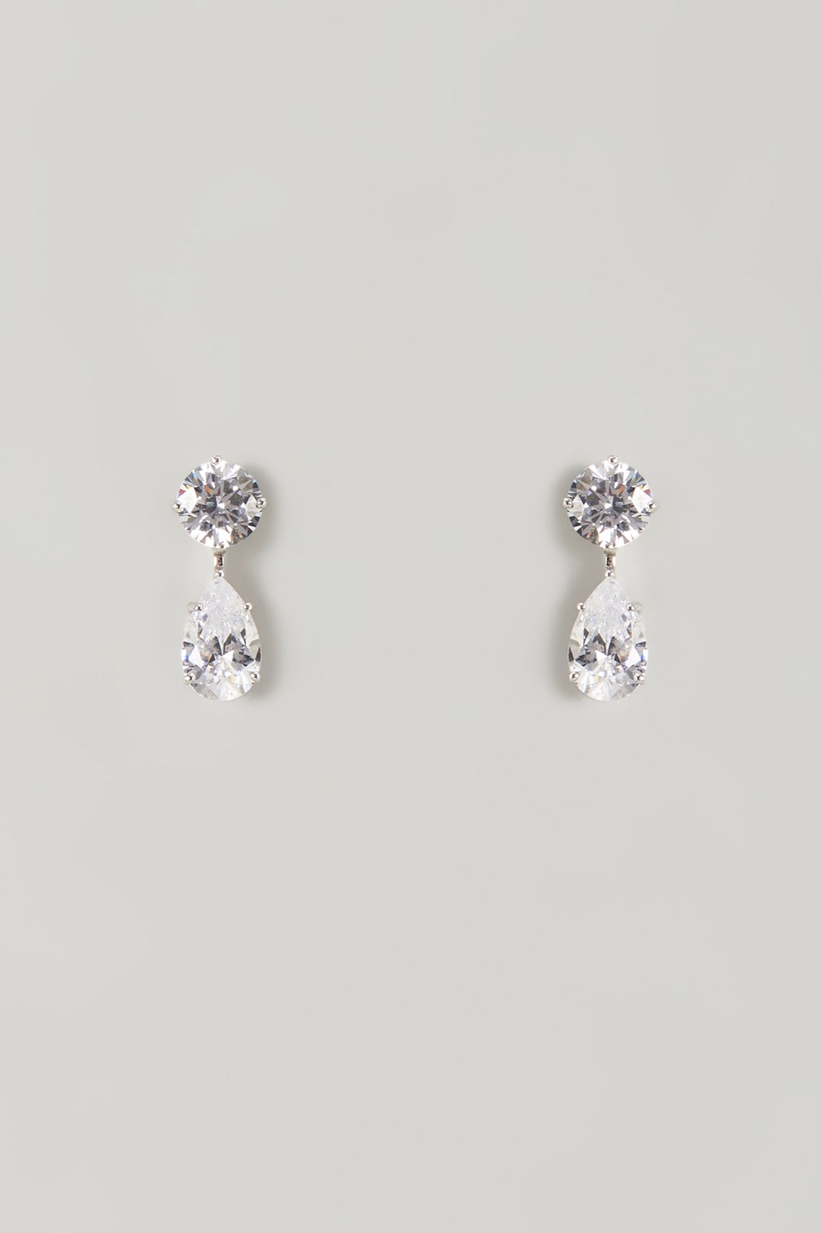 White Finish White Stone Stud Earrings In Sterling Silver