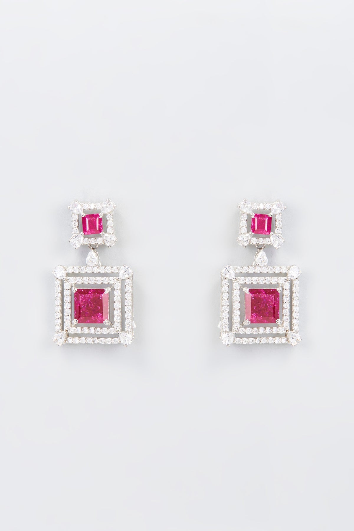 White Finish Zircon & Synthetic Red Stone Dangler Earrings In Sterling Silver