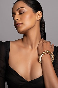 Gold Finish Bangle With A Red Stone