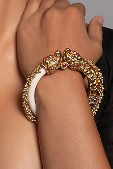 Gold Finish Bangle With A Red Stone