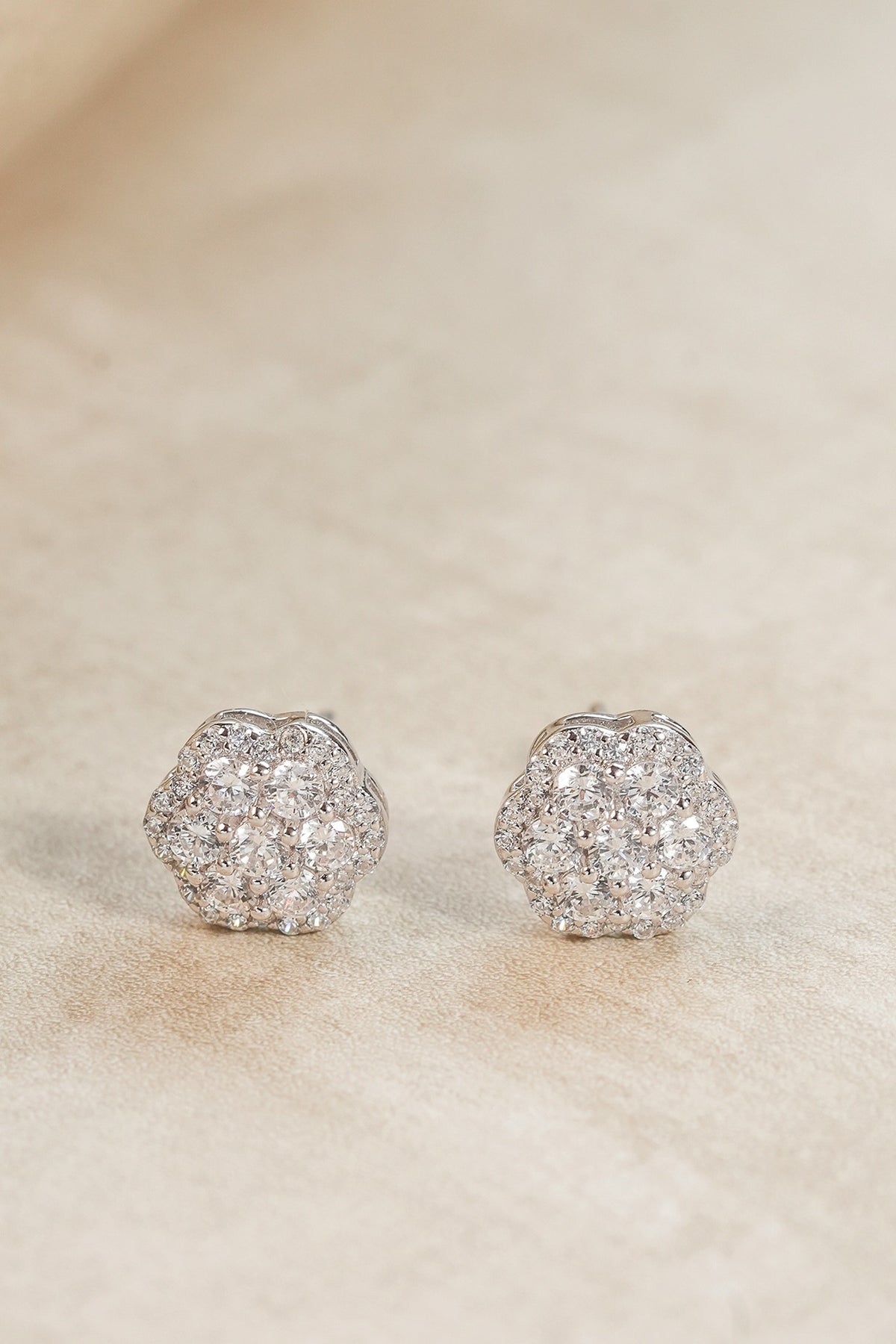 White Finish Zircon Floral Stud Earrings In Sterling Silver