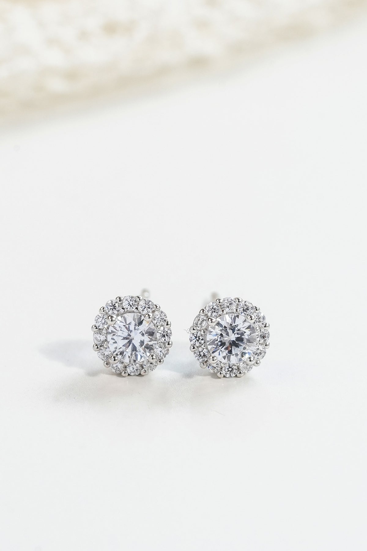 White Finish Zircon Stud Earrings In Sterling Silver