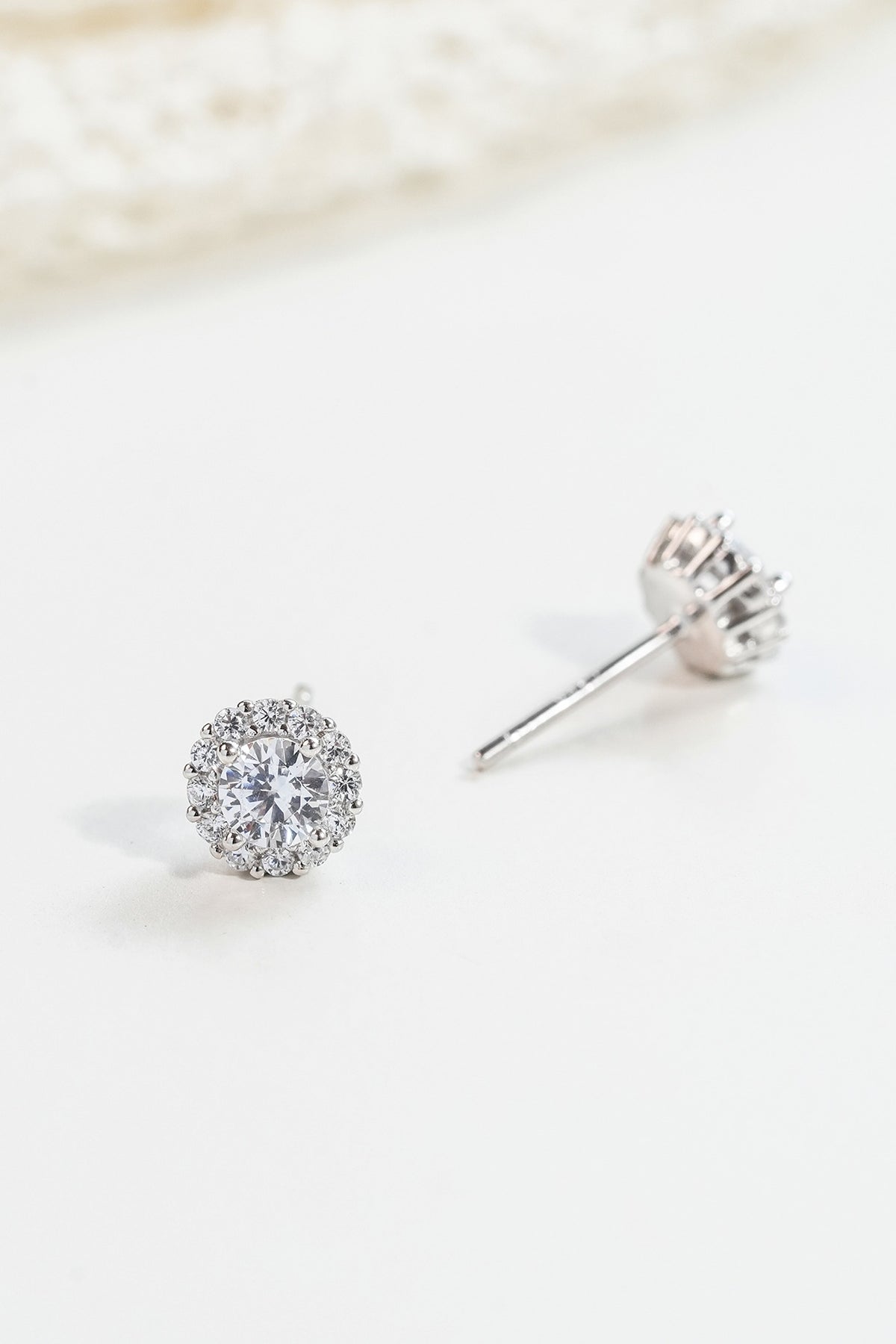 White Finish Zircon Stud Earrings In Sterling Silver