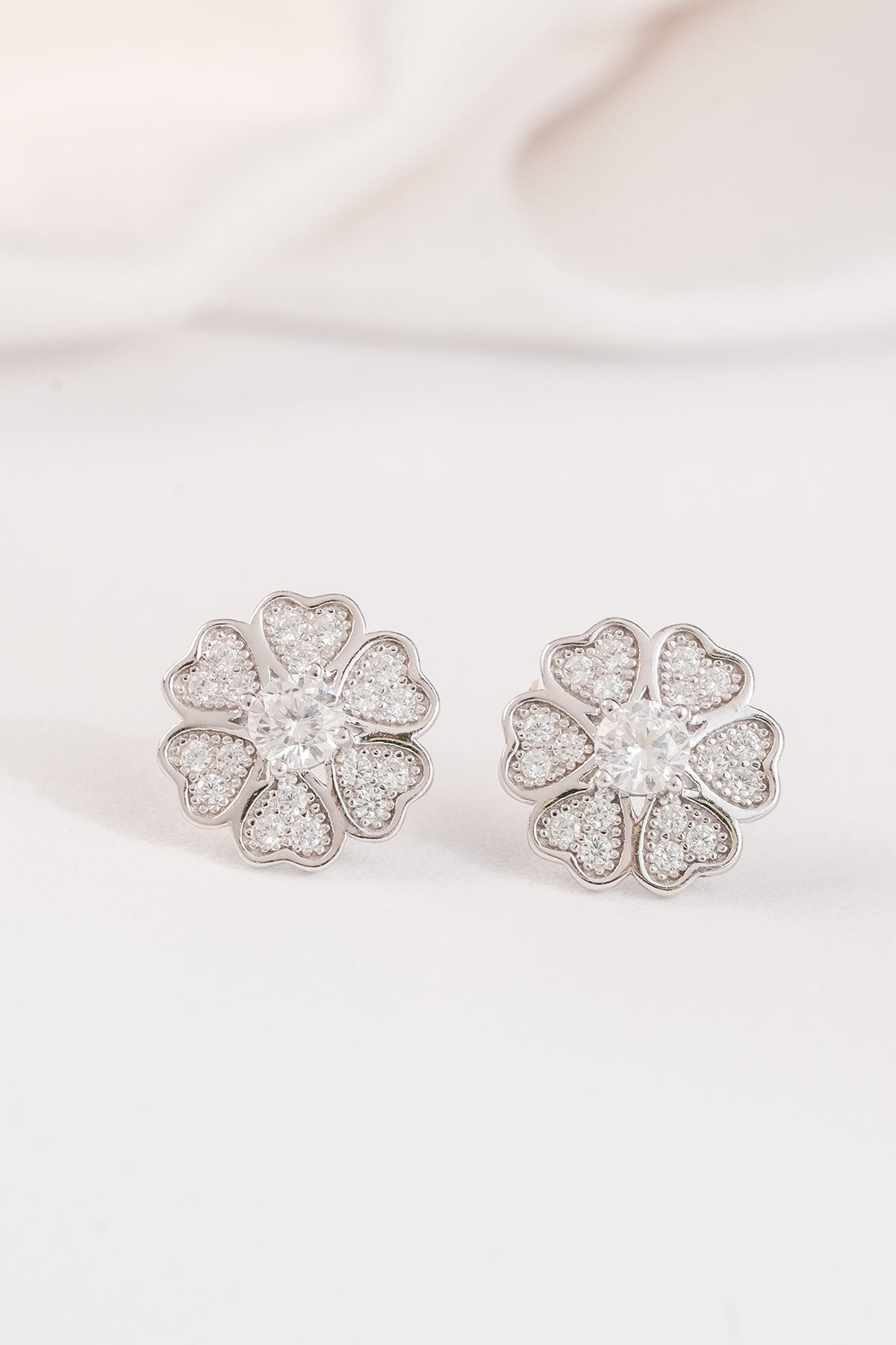 White Finish Zircon Floral Stud Earrings In Sterling Silver