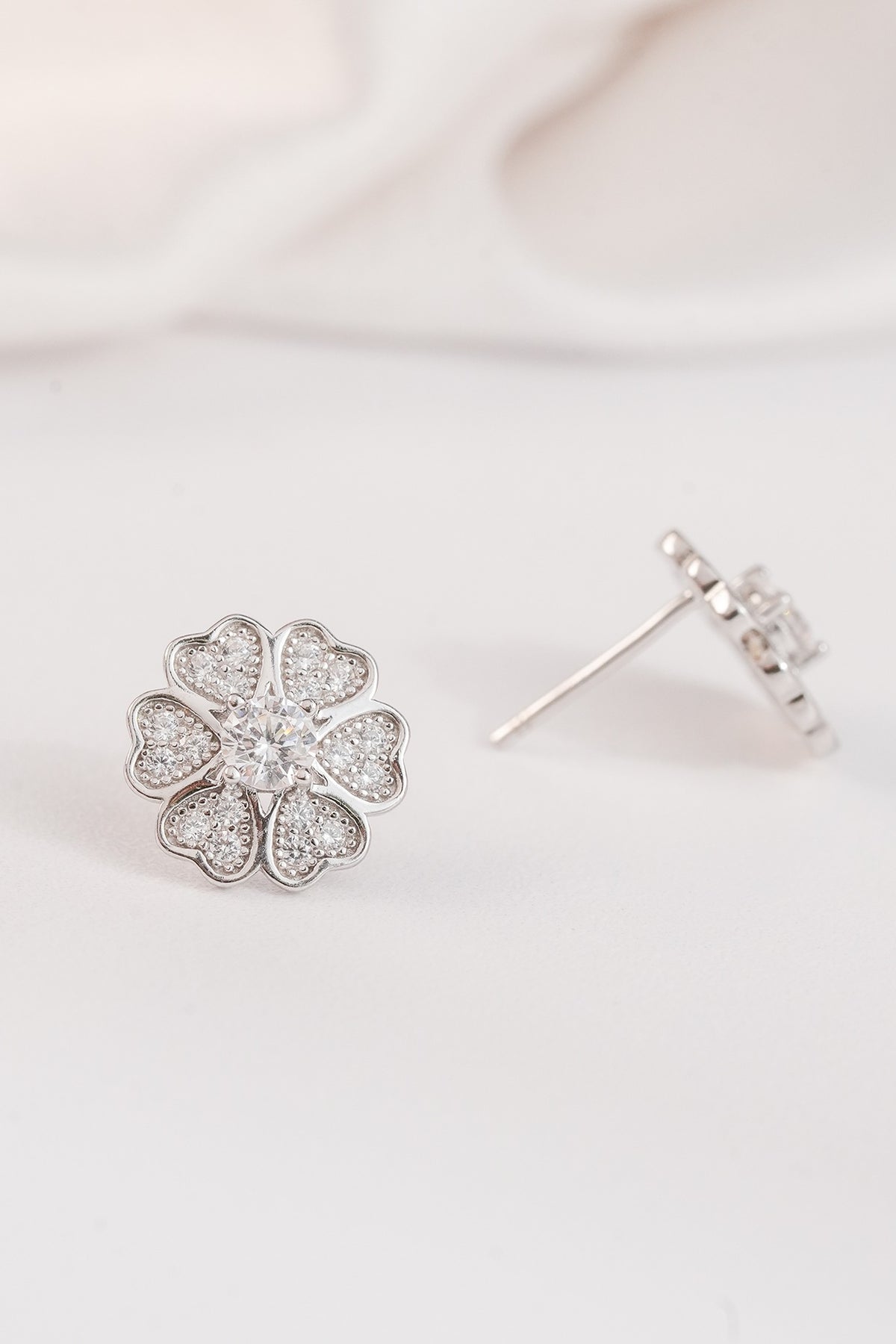 White Finish Zircon Floral Stud Earrings In Sterling Silver