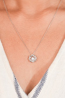White Finish Zircon Knotted Pendant Necklace In Sterling Silver