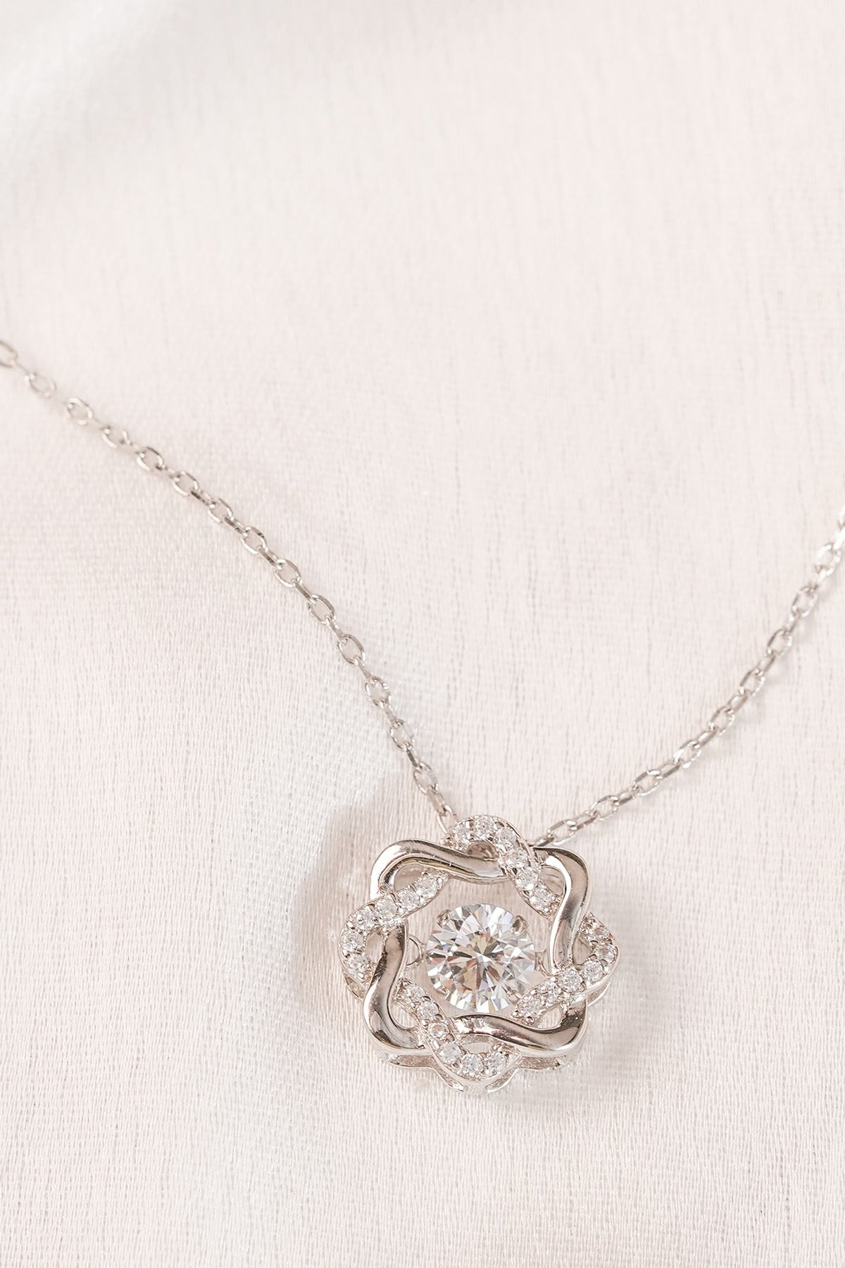 White Finish Zircon Knotted Pendant Necklace In Sterling Silver