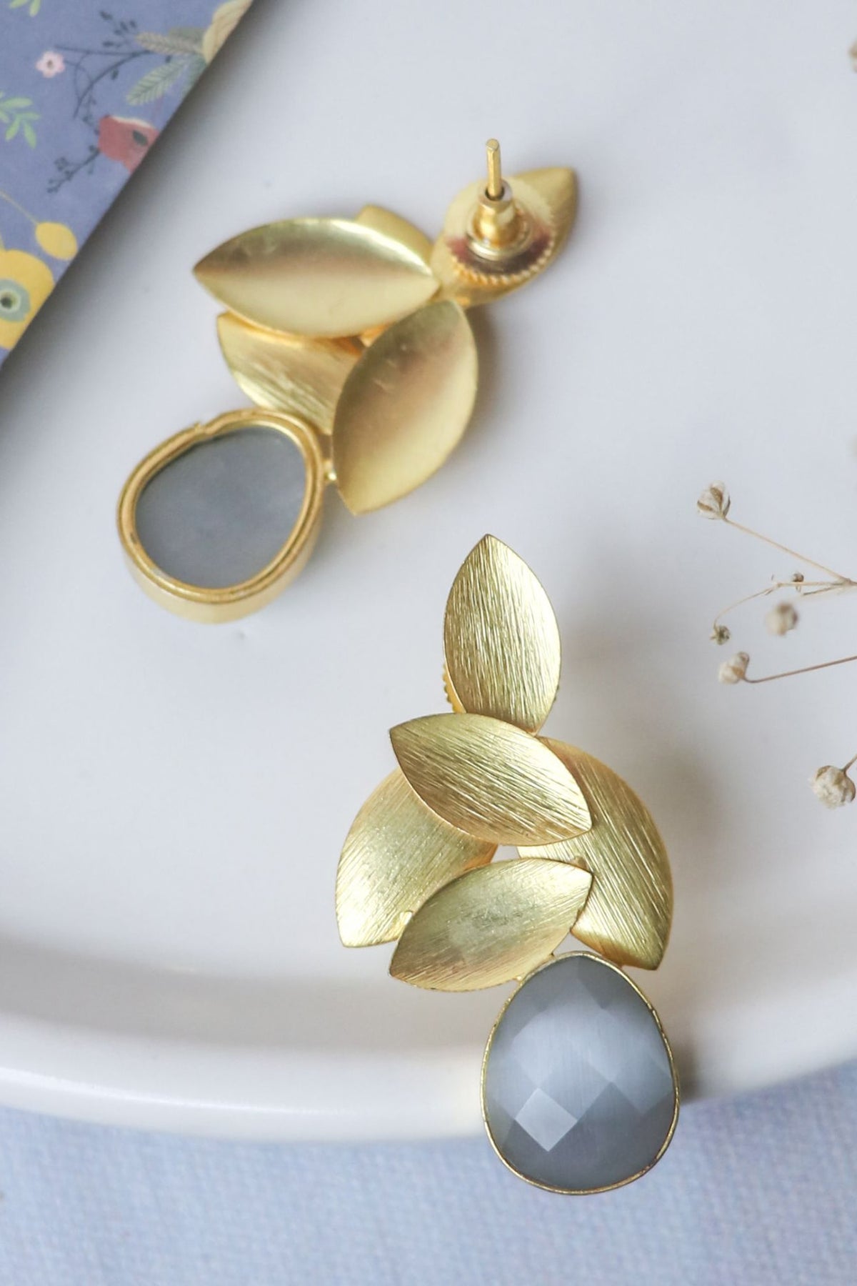 Gold Finish Grey Synthetic Stone Leaf Stud Earrings