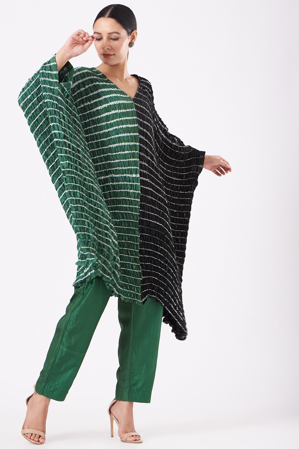 Featuring a bottle green and black handwoven kaftan in silk base with shibori pattern and hand dyed print. This contains only one piece.

FIT: Cut for relaxed fit.
COMPOSITION: Silk.
CARE: Dry clean only.