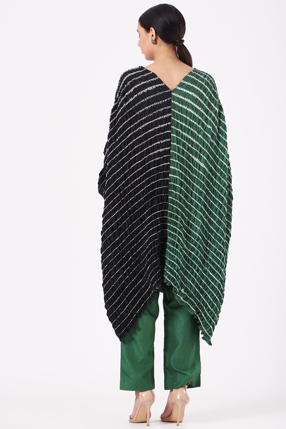 Featuring a bottle green and black handwoven kaftan in silk base with shibori pattern and hand dyed print. This contains only one piece.

FIT: Cut for relaxed fit.
COMPOSITION: Silk.
CARE: Dry clean only.