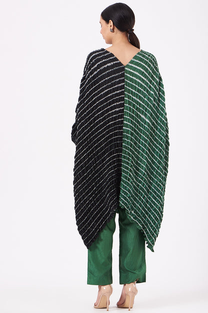 Featuring a bottle green and black handwoven kaftan in silk base with shibori pattern and hand dyed print. This contains only one piece.

FIT: Cut for relaxed fit.
COMPOSITION: Silk.
CARE: Dry clean only.