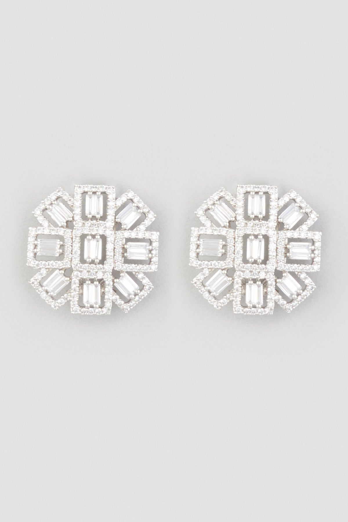 White Finish Zircons Stud Earrings In Sterling Silver
