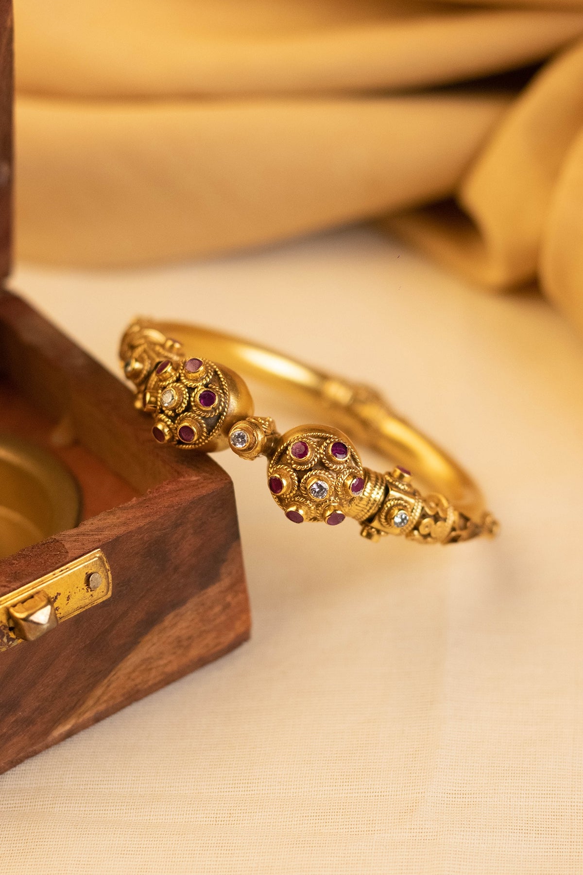 Gold Finish Onyx Temple Bangle In Sterling Silver