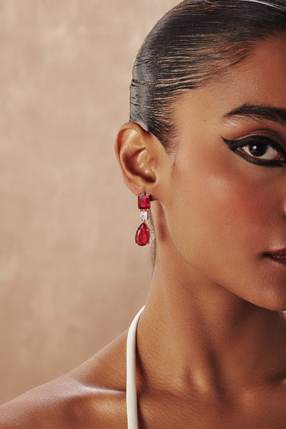 White Rhodium Finish Ruby Teardrop Cubic Zirconia Crystal Dangler Earrings In Sterling Silver